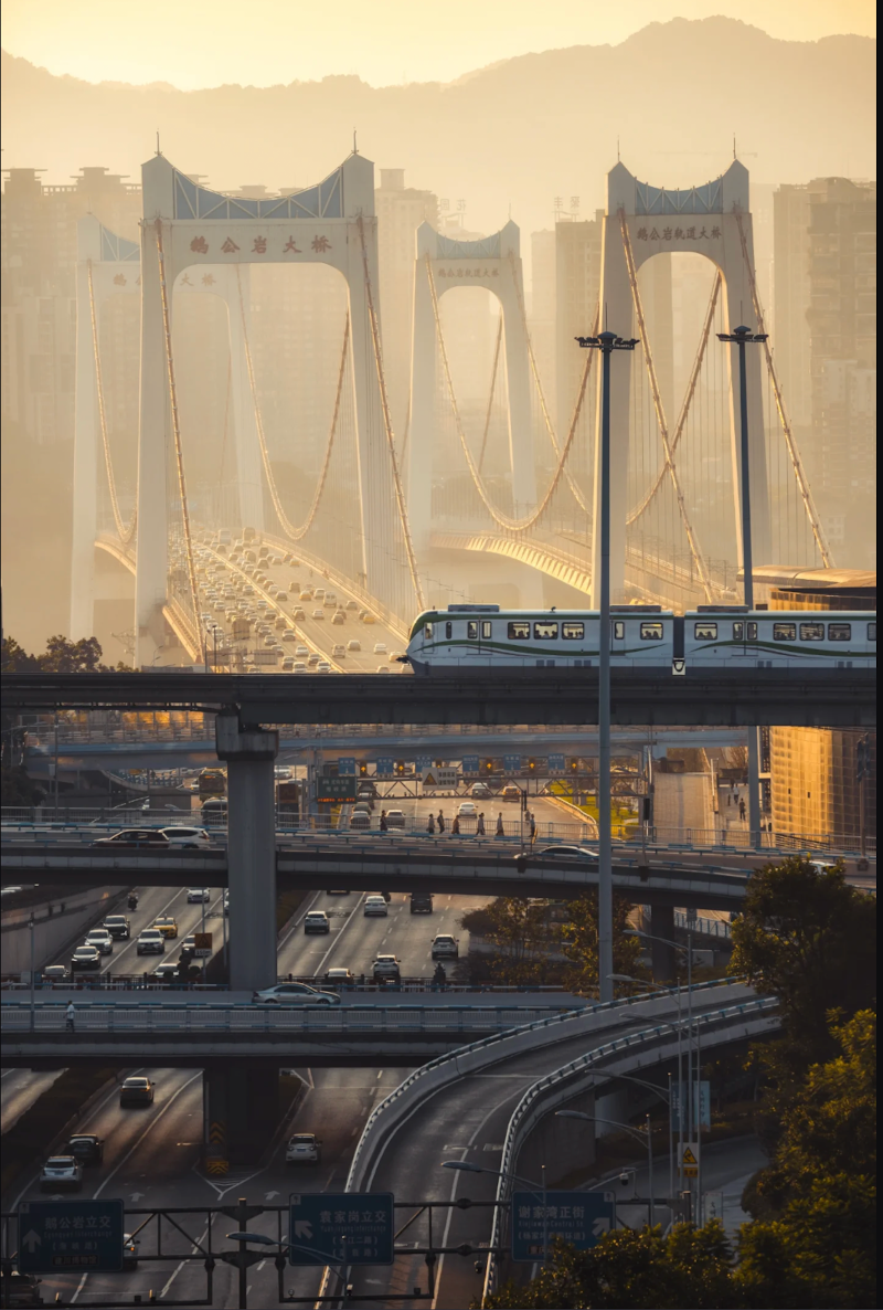 Golden morning light across Chongqing bridges, roads and rail