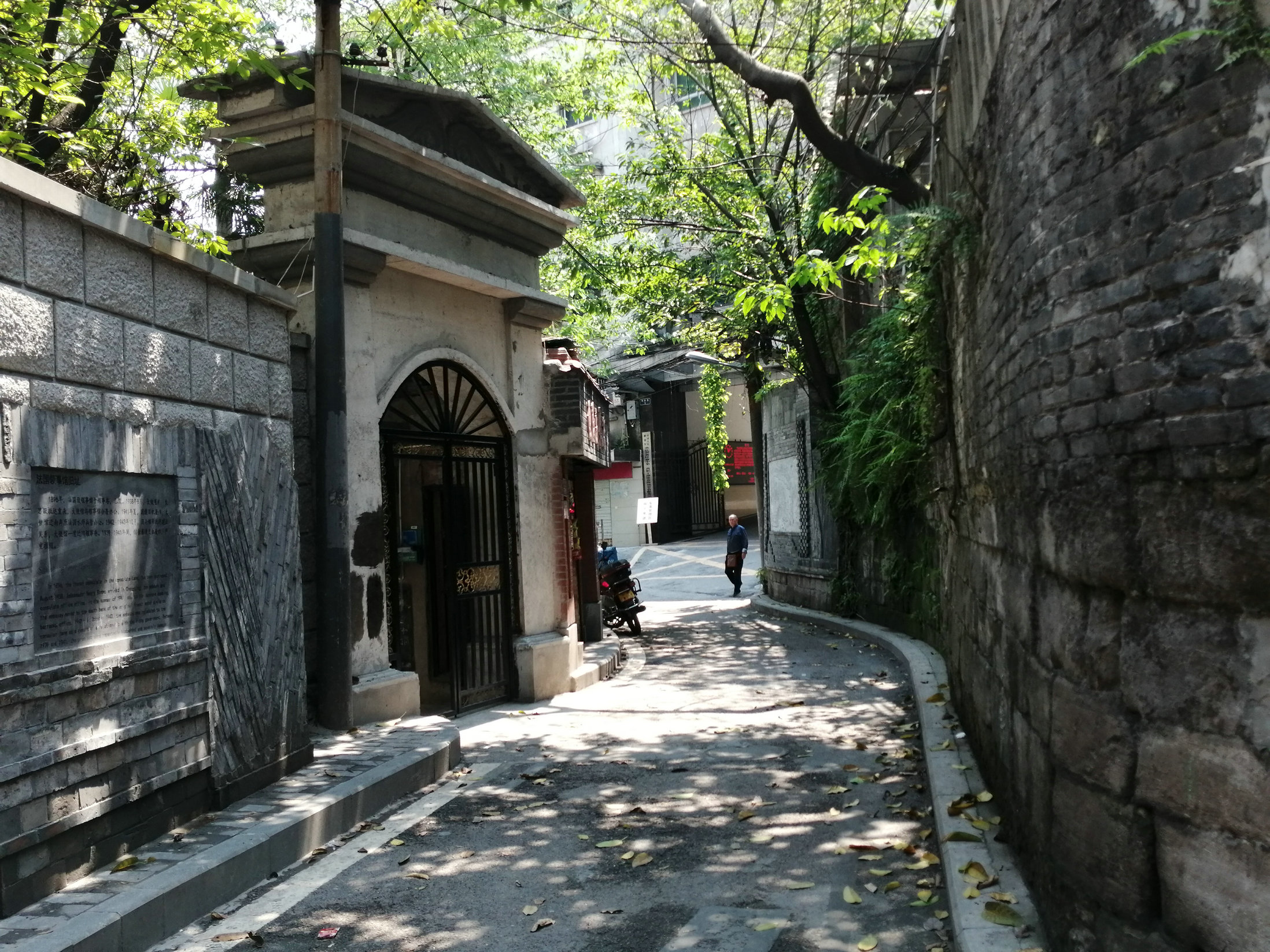 A quiet Chongqing lane opening toward the layered city